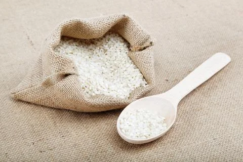 Rice in a bag on sacking. Stock Photos
