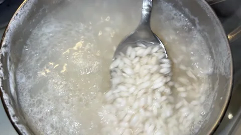 Rice is boiled in the pot Video stock 221272216