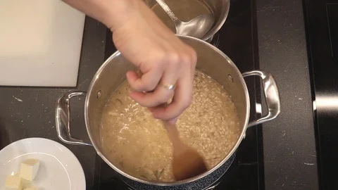 Rice boiling in wine overhead Stock Footage 112127654