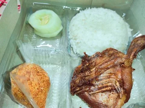 Rice box containing fried duck and rice Stock Photos