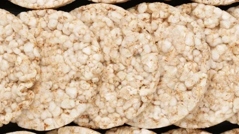 Rice bread with buckwheat. Rice cake on a black background. Stock Footage 142518651
