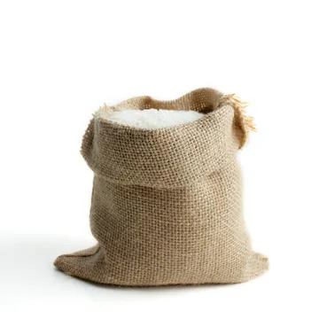Rice in burlap sack Stock Photos