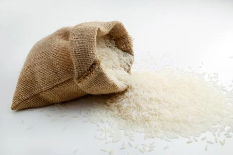 Rice in burlap sack Stock Photos