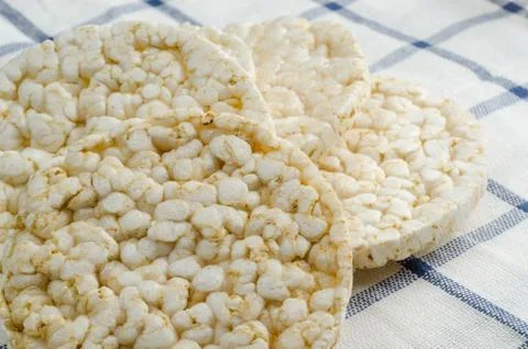 Rice cake, puffed rice on table cloth Stock Photos