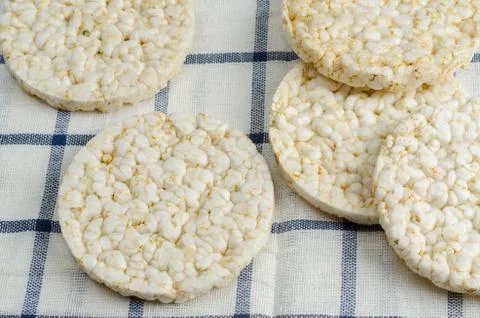 Rice cake, puffed rice on table cloth Stock Photos