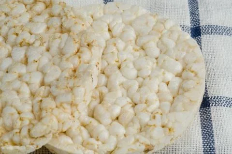 Rice cake, puffed rice on table cloth.. Stock Photos