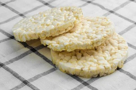 Rice cake, puffed rice on table cloth.. Stock Photos