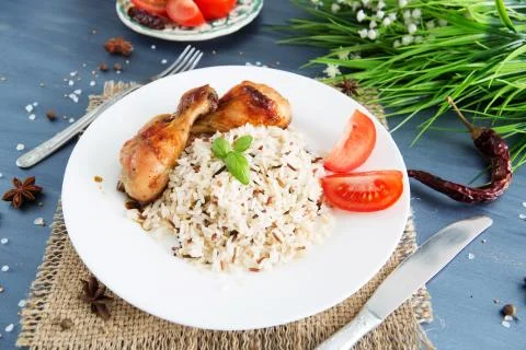 Rice with chicken on a serving gray table 스톡 사진