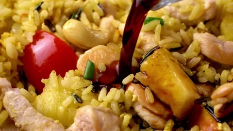 Rice close-up view with chicken and pineapple with soy sauce in slow motion Video stock 138567834