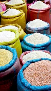 Rice in colorful sack Stock Photos