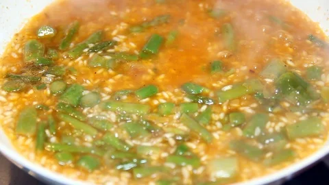 Rice cooking in a pan close up Stock Footage 98817346