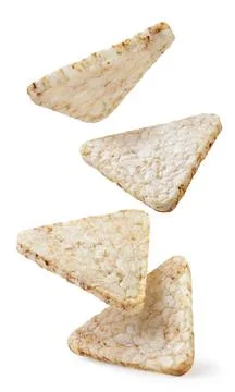 Rice crisps triangles falling on white background. Isolated Stock Photos