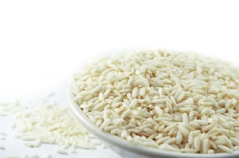 Rice in cup on white background / raw white Jasmine rice dry for food Stock Photos