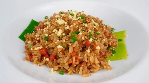 Rice dish, mixed with egg, soy sauce and sesame seeds, served in Restaurant Stock Footage 95673795