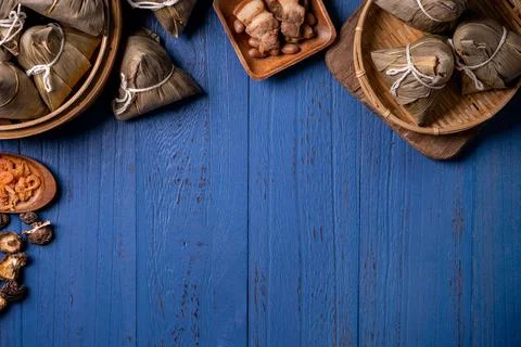 Rice dumpling, zongzi - Traditional Chinese food on blue wooden background of Stock Photos