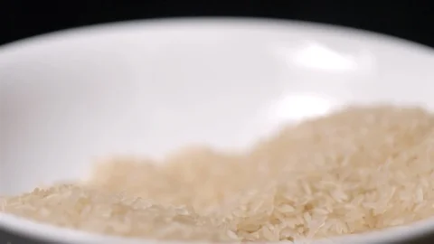 Rice falling in hand slow motion Video stock 99092730