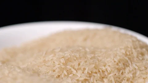 Rice falling in hand slow motion Stock-Footage 99092807