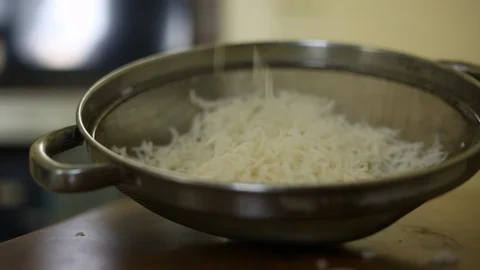 Rice falling from height in a dish Stock Footage 129951954
