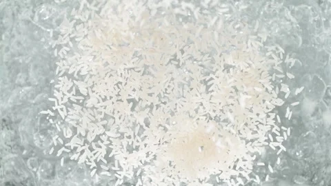 Rice Falling into Pot of Boiling Water Stock Footage 271398332