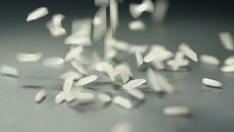 Rice falling in slow motion on black background Stock Footage 115141667