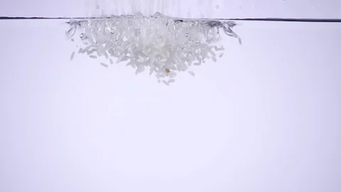 Rice falling into the water Stock Footage 78873276
