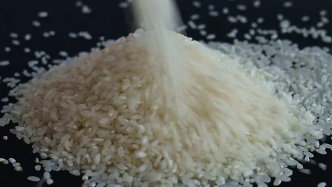 Rice falls back black background Video stock 74248728