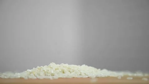 Rice falls on a cutting board Stock Footage 195112079