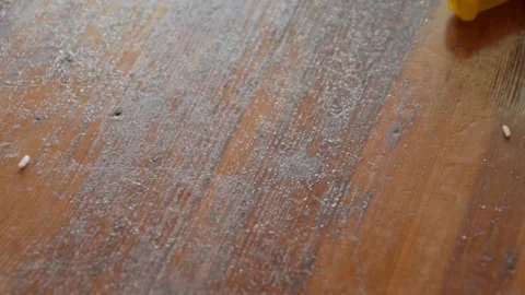 Rice falls on the kitchen table. A lot of rice on the table. Stock Footage 130743856
