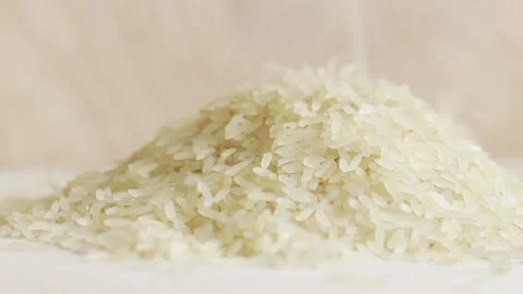 Rice falls into a table Stock Footage 236123660