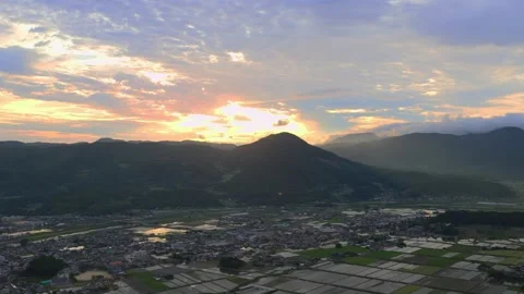 Rice fields and the morning glow seen from the summit Stock Footage 342230002