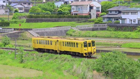 Rice fields and a train in Yufuin (Yufuin, Yufu City, Oita Prefecture) Stock Footage 341953205