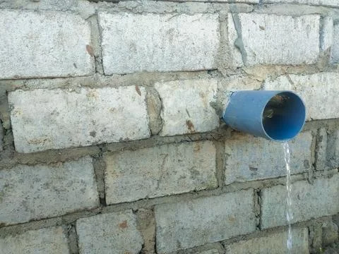 The rice fields are irrigated using pump wells with the technique of pumpin.. Stock Photos
