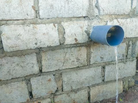 The rice fields are irrigated using pump wells with the technique of pumpin.. Stock Photos
