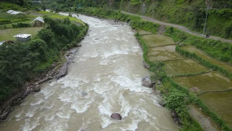 Rice fields with the mountain river in NEPAL, Aerial drone view Stock Footage 155962699