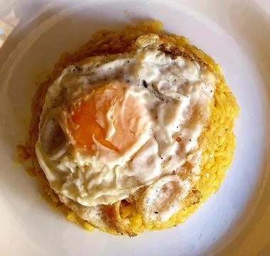 Rice with a fried egg Stock Photos