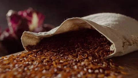Rice grains fall on wood table Stock Footage 135009684