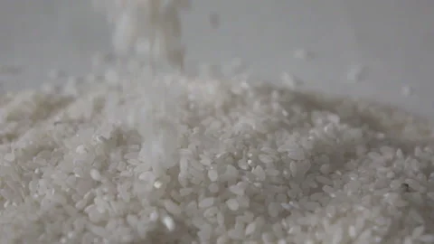 Rice grains falling down in slow motion Stock Footage 86523697