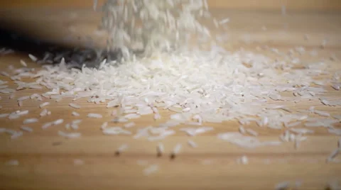Rice grains falling in slow motion Stock Footage 54585773