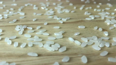 Rice grains falling on the table, super slow motion video. 스톡 동영상 155263455