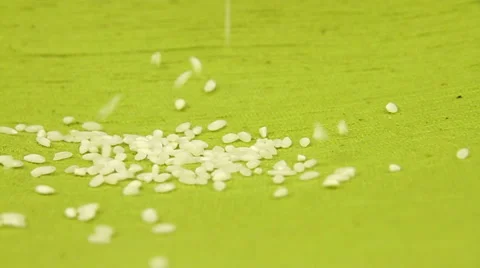 Rice grains on a green background Stock Footage 58872302