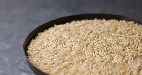 Rice grains rotating in seamless macro loop tilt shift video Video stock 320979067