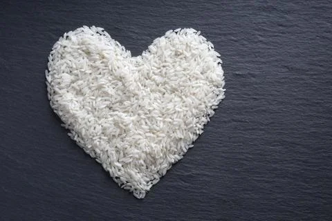 Rice in heart shape Stock Photos