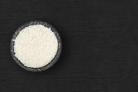 Rice inside a rustic bowl 스톡 사진