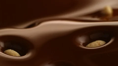 Rice Krispies fall into chocolate bath2 Stock-Footage 94568357