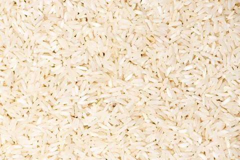 Rice macro background texture. Rice raw grains closeup. Rice pattern detail.. Stock Photos