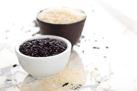 Rice on marble table. Stock Photos