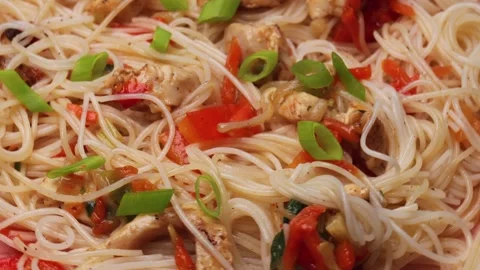 Rice noodles with chicken and vegetables, rotation in circle. asian cuisine Stock Footage 265416341