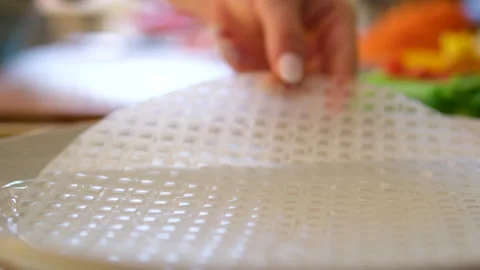 Rice paper background. Thick, Thai-style rice paper sheet top view, table spin. 스톡 동영상 302103031