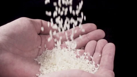 Rice is poured into hands Stock Footage 87289871