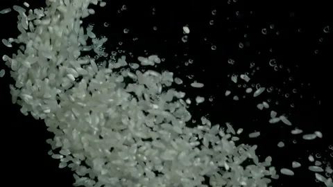 Rice is poured into water Stock Footage 169010495